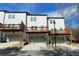 Townhome exterior showing garages and decks, providing outdoor and parking space at 353 Vista Ln, Woodstock, GA 30189