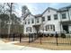 Charming townhome exterior features neutral siding, manicured landscaping, and inviting curb appeal at 353 Vista Ln, Woodstock, GA 30189