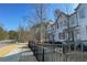 Charming townhome exterior features neutral siding, manicured landscaping, and inviting curb appeal at 353 Vista Ln, Woodstock, GA 30189