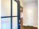 View of the foyer featuring a modern front door, coat closet, and hardwood floors at 353 Vista Ln, Woodstock, GA 30189