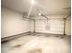 A clean and spacious garage features a white door and ample room for parking and storage at 353 Vista Ln, Woodstock, GA 30189