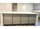 View of kitchen island with gray cabinets offering ample storage at 353 Vista Ln, Woodstock, GA 30189