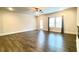 Spacious living room with windows, hardwood floors, and neutral paint at 353 Vista Ln, Woodstock, GA 30189