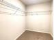 Walk-in closet with wire shelving and carpet flooring at 353 Vista Ln, Woodstock, GA 30189