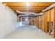 Unfinished basement with exposed beams and concrete foundation walls at 2541 Berwick Walk, Snellville, GA 30078