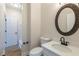 Bathroom featuring vanity with modern faucet and tile flooring at 2541 Berwick Walk, Snellville, GA 30078