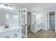Bathroom with double vanity, glass shower and soaking tub in view at 2541 Berwick Walk, Snellville, GA 30078