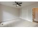 Bedroom featuring carpet, ceiling fan, closet, and access to the en suite at 2541 Berwick Walk, Snellville, GA 30078