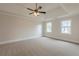 Spacious bedroom featuring carpet, ceiling fan, and double windows at 2541 Berwick Walk, Snellville, GA 30078