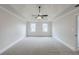 Spacious bedroom features a tray ceiling, fan, and neutral carpet at 2541 Berwick Walk, Snellville, GA 30078