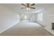 Large bonus room featuring a fireplace and windows for natural light at 2541 Berwick Walk, Snellville, GA 30078
