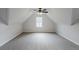 Large bonus room features neutral carpet and a single window at 2541 Berwick Walk, Snellville, GA 30078