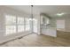 Bright dining room featuring hardwood floors, a modern chandelier, and backyard views at 2541 Berwick Walk, Snellville, GA 30078