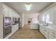 Bright kitchen with modern appliances, cabinets, hardwood floors and plenty of counter space at 2541 Berwick Walk, Snellville, GA 30078