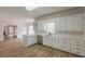 Kitchen with modern cabinets, stainless steel appliances, and hardwood floors at 2541 Berwick Walk, Snellville, GA 30078