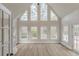Bright, airy living room with many windows, hardwood floors, and high ceilings at 2541 Berwick Walk, Snellville, GA 30078