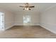 Spacious living room featuring hardwood floors, white trim, and a ceiling fan at 2541 Berwick Walk, Snellville, GA 30078