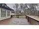 Back deck features wood railings and flooring for outdoor relaxation and scenic views at 250 Southmoor Cir, Stockbridge, GA 30281