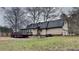 Exterior view of the rear of the house showing the deck, lawn and backyard at 250 Southmoor Cir, Stockbridge, GA 30281