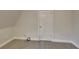 A cozy carpeted bedroom features a neutral wall at 250 Southmoor Cir, Stockbridge, GA 30281