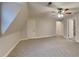 Large carpeted bedroom featuring a ceiling fan at 250 Southmoor Cir, Stockbridge, GA 30281