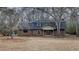 Charming two-story brick home featuring a classic design and well-maintained landscaping in a natural setting at 250 Southmoor Cir, Stockbridge, GA 30281