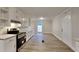 Well-lit kitchen features white cabinetry, modern appliances, and a functional layout for cooking at 250 Southmoor Cir, Stockbridge, GA 30281