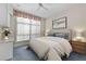 Cozy bedroom with large window, neutral walls, ceiling fan and a comfortable bed at 750 Park Ne Ave # 21E, Atlanta, GA 30326