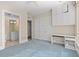 Spacious bedroom with a built-in desk, closet, and an ensuite bathroom with modern fixtures at 750 Park Ne Ave # 21E, Atlanta, GA 30326
