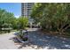 View of the building's gated entrance on a sunny day at 750 Park Ne Ave # 21E, Atlanta, GA 30326