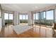 Open-plan living room with hardwood flooring, large windows, and balcony access at 750 Park Ne Ave # 21E, Atlanta, GA 30326