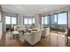 Bright living room featuring hardwood floors and expansive windows at 750 Park Ne Ave # 21E, Atlanta, GA 30326