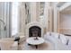 Elegant lobby with stylish fireplace, seating, and mirrored columns at 750 Park Ne Ave # 21E, Atlanta, GA 30326