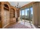 Office with custom bookshelves and a scenic view from the expansive window at 750 Park Ne Ave # 21E, Atlanta, GA 30326