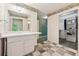 Bathroom featuring marble floors, single vanity, mirror, closet and doorway to green room at 2057 Sugar Pike Rd, Woodstock, GA 30188