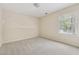 Bedroom with carpeted floor and view of yard from the window at 2057 Sugar Pike Rd, Woodstock, GA 30188