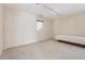 Bedroom with light carpet, a bed, and small window above the bed at 2057 Sugar Pike Rd, Woodstock, GA 30188