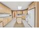 Bright kitchen with light-colored cabinetry, center island, and white appliances at 2057 Sugar Pike Rd, Woodstock, GA 30188