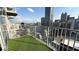 Balcony featuring artificial grass flooring and gorgeous, panoramic city views at 400 W Peachtree Nw St # 2808, Atlanta, GA 30308
