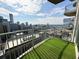 This cozy balcony has an artificial grass surface and overlooks an expansive city view at 400 W Peachtree Nw St # 2808, Atlanta, GA 30308