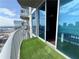 This balcony features artificial grass, sliding glass doors, and beautiful city views at 400 W Peachtree Nw St # 2808, Atlanta, GA 30308