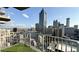 Stunning balcony view of the city skyline from a high-rise apartment with clear sky and modern railings at 400 W Peachtree Nw St # 2808, Atlanta, GA 30308