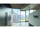 Sun-filled bedroom showcases an expansive window overlooking the cityscape at 400 W Peachtree Nw St # 2808, Atlanta, GA 30308
