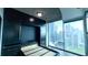 Bedroom with modern storage, Murphy bed, and bright city views at 400 W Peachtree Nw St # 2808, Atlanta, GA 30308