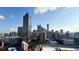 An eye-level, daytime view of a modern cityscape with tall buildings under a partly cloudy sky at 400 W Peachtree Nw St # 2808, Atlanta, GA 30308