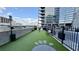 A dog park with artificial turf, fire hydrant, benches and plenty of room to roam at 400 W Peachtree Nw St # 2808, Atlanta, GA 30308