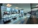 Bright gym with treadmills, elliptical machines, weight bench, and large windows with a cityscape view at 400 W Peachtree Nw St # 2808, Atlanta, GA 30308