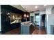 Sleek kitchen with granite counters, modern backsplash, stainless appliances, and city-themed art at 400 W Peachtree Nw St # 2808, Atlanta, GA 30308