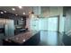 Modern kitchen features stainless appliances, granite counters and industrial pendant lighting with a balcony view at 400 W Peachtree Nw St # 2808, Atlanta, GA 30308