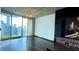 Modern living room with gleaming hardwood floors, floor to ceiling windows, and city view at 400 W Peachtree Nw St # 2808, Atlanta, GA 30308